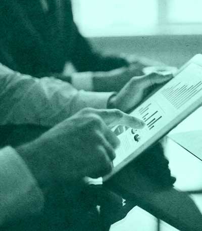 closeup of someone pointing at tablet